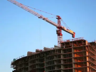 Tower crane above a building under construction